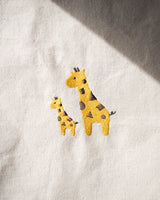 Close up view of the small and large giraffe embroidery design